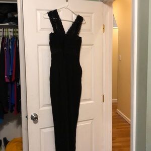 Black jumpsuit with lace straps and lace cut outs